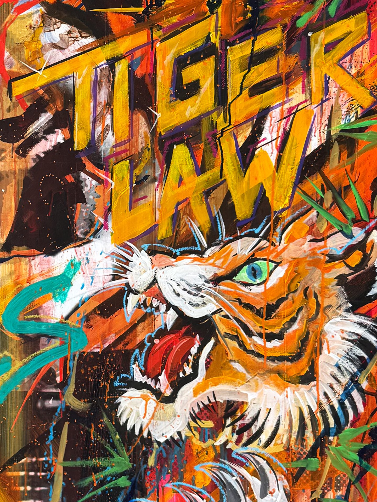 Bold graffiti-style artwork with large yellow letters, an orange/red background, and a white tiger head near the bottom center.